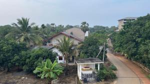 a house on the side of a road with trees at Saa in Anuradhapura