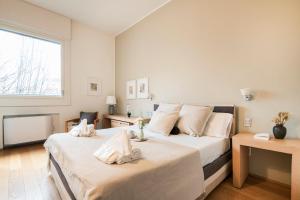 A bed or beds in a room at Wonderful Brera flat