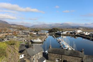 a town with a marina with boats in the water at 59A South Snowdon Wharf in Porthmadog