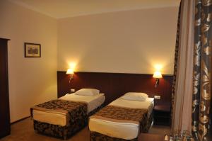 Кровать или кровати в номере Бугарь Отель