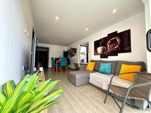 a living room with a couch and a table at Mantu Apartment in Cusco