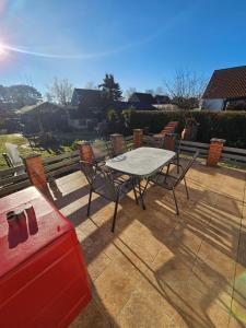 a table and chairs sitting on a patio at Kapitänshaus - Terrassenstube in Barth