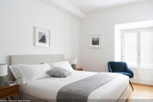 En eller flere senge i et værelse på Brera Apartments in San Fermo