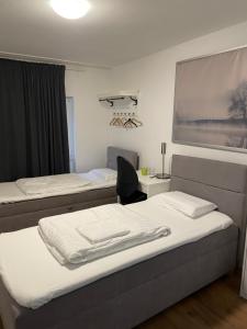 A bed or beds in a room at Hotel Hecht