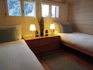 Postel nebo postele na pokoji v ubytování Chalet Sonnenhof Wengen