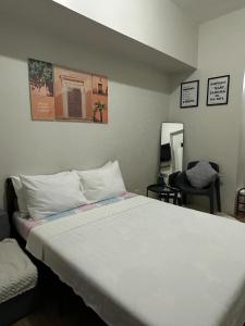Vuode tai vuoteita majoituspaikassa Spacious Condo at Limketkai CDO