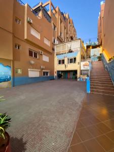 an empty street in front of a building at Sunrise sea view apartment A17 in Tamraght Ou Fella