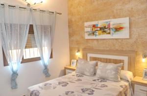 Łóżko lub łóżka w pokoju w obiekcie Chalet Sultan con piscina