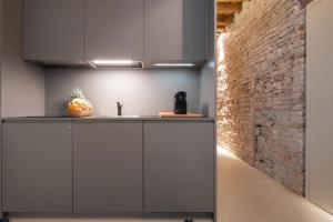 A kitchen or kitchenette at OFFICINE CAVOUR Piazza Cavour