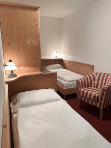 Postel nebo postele na pokoji v ubytování Albergo Al Pin