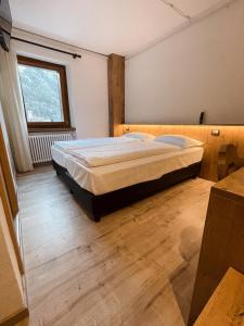 Postel nebo postele na pokoji v ubytování Albergo Al Pin