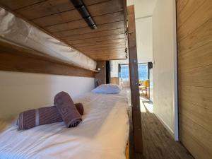 Ένα ή περισσότερα κρεβάτια σε δωμάτιο στο PLA134 - SUPERBE Appt 4-6pers traversant coeur val Claret