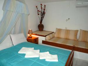 Posteľ alebo postele v izbe v ubytovaní Violetta Studios & Apartments