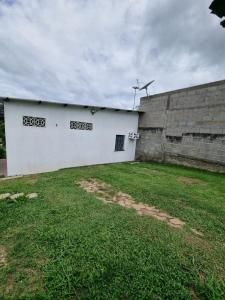a white building with a windmill on top of it at Apartamento em Presidente Figueiredo in Presidente Figueiredo