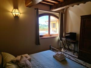 En eller flere senge i et værelse på Agriturismo Il Bagnano + 67 billeder