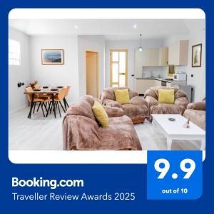a living room with a couch and a table at Spacious & Relaxing Home with Free Parking in Vlorë