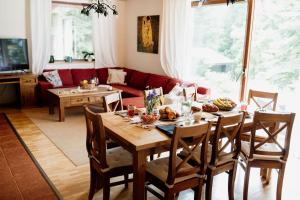 a living room with a table and a couch at Chata Hana Donovaly in Donovaly