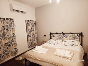 Postel nebo postele na pokoji v ubytování La Corte Guesthouse