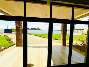 a view from the inside of a house through a window at Matrogwane BnB and Hall in Newcastle +14 photos
