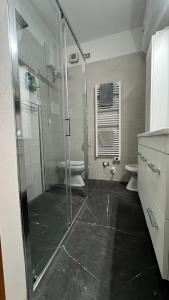 a bathroom with a shower and a toilet at Casa Chaya in Sorso