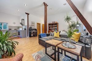 a living room with a couch and a table at Ferienwohnung Varga Schafstedt in Schafstedt