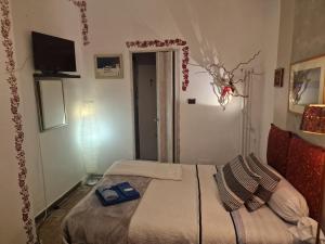Postel nebo postele na pokoji v ubytování B&B La Riva del Po Camera indipendente