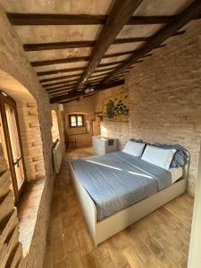 Postel nebo postele na pokoji v ubytování Spello Sant'Onofrio