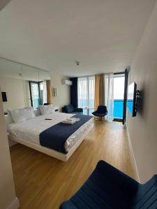 Postel nebo postele na pokoji v ubytování Seaside apartments In batumi