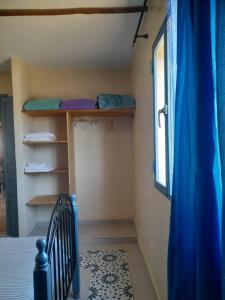 a bedroom with a bunk bed and a window at le Doux refuge 2 in Essaouira