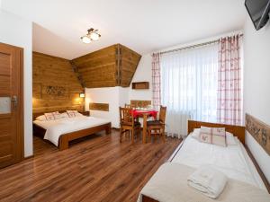 Posteľ alebo postele v izbe v ubytovaní Willa Pod Reglami Małe Ciche Sauna & Jacuzzi