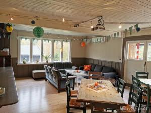 a restaurant with tables and chairs in a room at Hemsedal - 7 bedrooms - WI-FI in Hemsedal