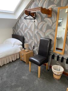 Postel nebo postele na pokoji v ubytování Belhaven Private Hotel