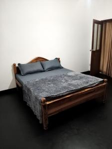 Ένα ή περισσότερα κρεβάτια σε δωμάτιο στο Senaya Homestay