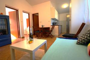 a living room with a couch and a table at Adriatic Vacation House in Ližnjan +15 photos