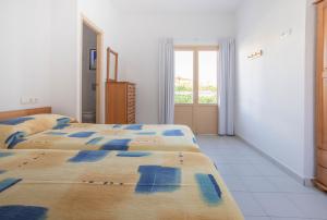 Posteľ alebo postele v izbe v ubytovaní Hostal Mayans