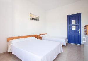 Posteľ alebo postele v izbe v ubytovaní Hostal Mayans