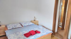 Posteľ alebo postele v izbe v ubytovaní Apartmány Podkovička