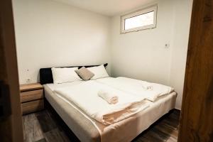 Postel nebo postele na pokoji v ubytování Siocamping Házak Homes