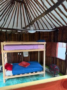 Ένα ή περισσότερα κρεβάτια σε δωμάτιο στο Tree House Tulum