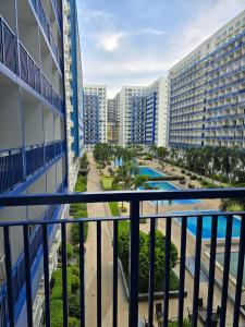 a view from the balcony of a resort at Sea Residences EZBedz in Manila