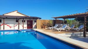 Bazén v ubytování Pousada Coral de Fogo nebo v jeho okolí