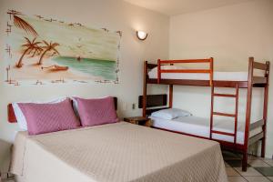 Postel nebo postele na pokoji v ubytování Pousada Coral de Fogo