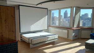 Posteľ alebo postele v izbe v ubytovaní Sunny Apartment Warszawa