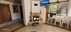 an aerial view of a living room with a fireplace at Dom letniskowy nad jeziorem Wigry Staw Suwalszczyzna in Suwałki +22 photos
