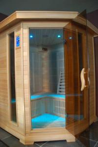 a large shower with blue lights in a room at L'Alidade Chambres d'hôtes in Wimereux