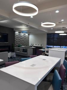 an office with a large white table and chairs at La Quinta Inn by Wyndham Columbia SE Fort Jackson in Columbia +28 photos