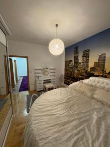 Ένα ή περισσότερα κρεβάτια σε δωμάτιο στο Ameti Apartments