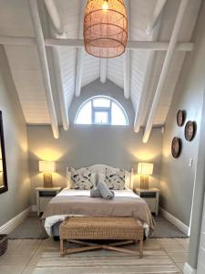 a bedroom with a bed and a large window at Riptide at no 14 in Sea Vista