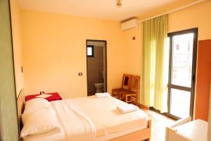 Postel nebo postele na pokoji v ubytování Haka Guesthouse