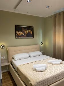 Postel nebo postele na pokoji v ubytování Novs Apartment3